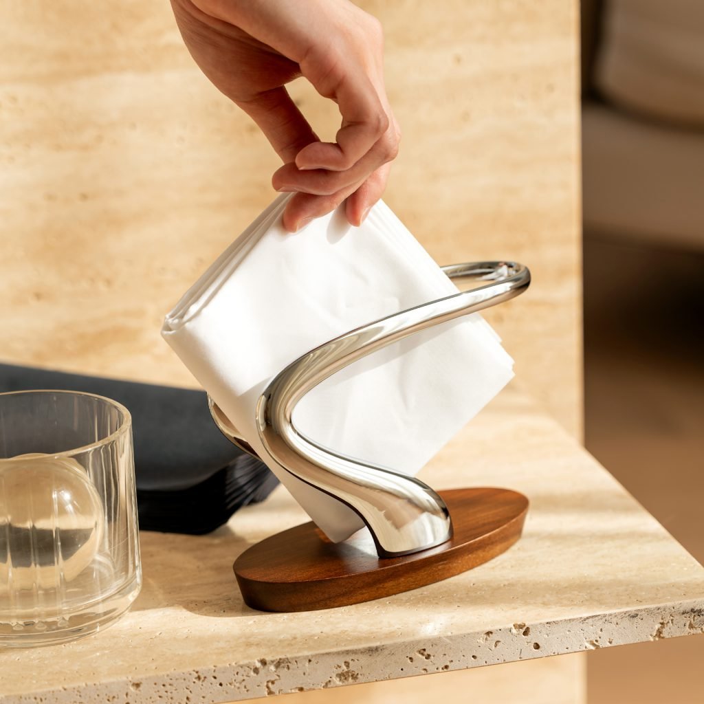 Steel Napkin Holder (SS-10) featuring a mirror-polished U-shaped vertical structure and a heavy-gauge base, showcased as a Luxury Mirror Polished Tableware Organizer.