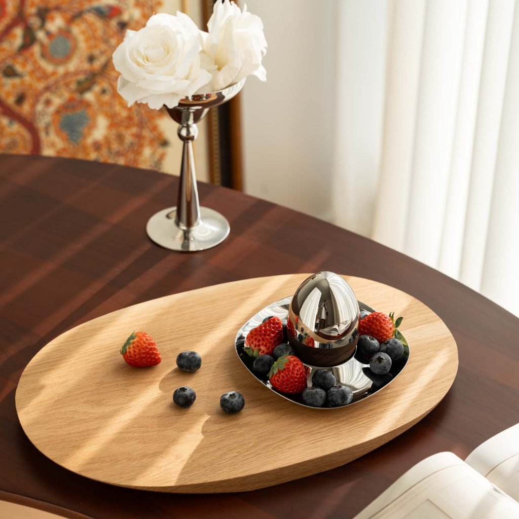 Steel Egg Holder featuring a mirror-polished pedestal base and a curved cup, showcased as a Luxury Mirror Polished Egg Cup.