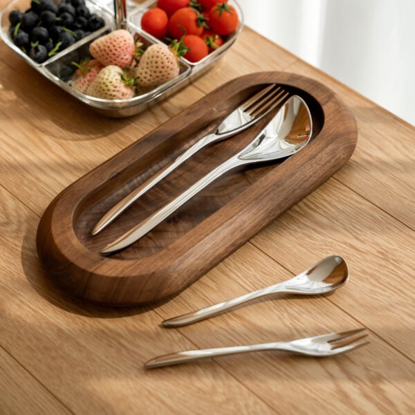 Steel Flatware Set featuring a complete place setting with knife, fork, and spoons, showcased as Luxury Mirror Polished Cutlery.