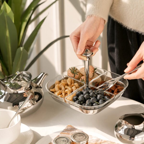 Glass Snack Server featuring four clear glass bowls arranged in a stainless steel frame with a loop handle, showcased as a Luxury 4-Compartment Appetizer Tray.