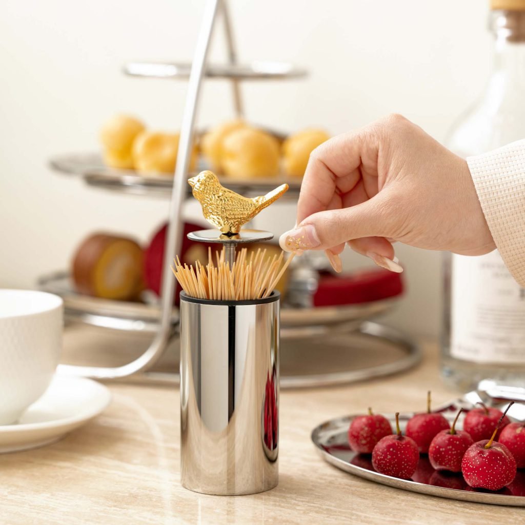 Steel Bird Toothpick holder (SS-107) featuring a mirror-polished base and a soaring bird finial, showcased as a Luxury Mirror Polished Bird Holder.