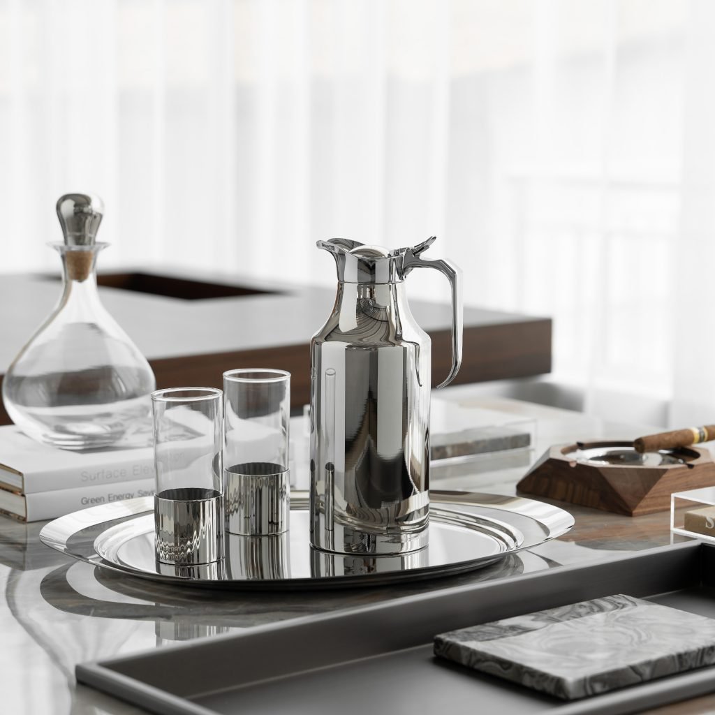Steel Thermal Carafe (SS-24) featuring a mirror-polished streamlined body and ergonomic handle for professional beverage service, showcased as a Luxury Mirror Polished Vacuum Server.