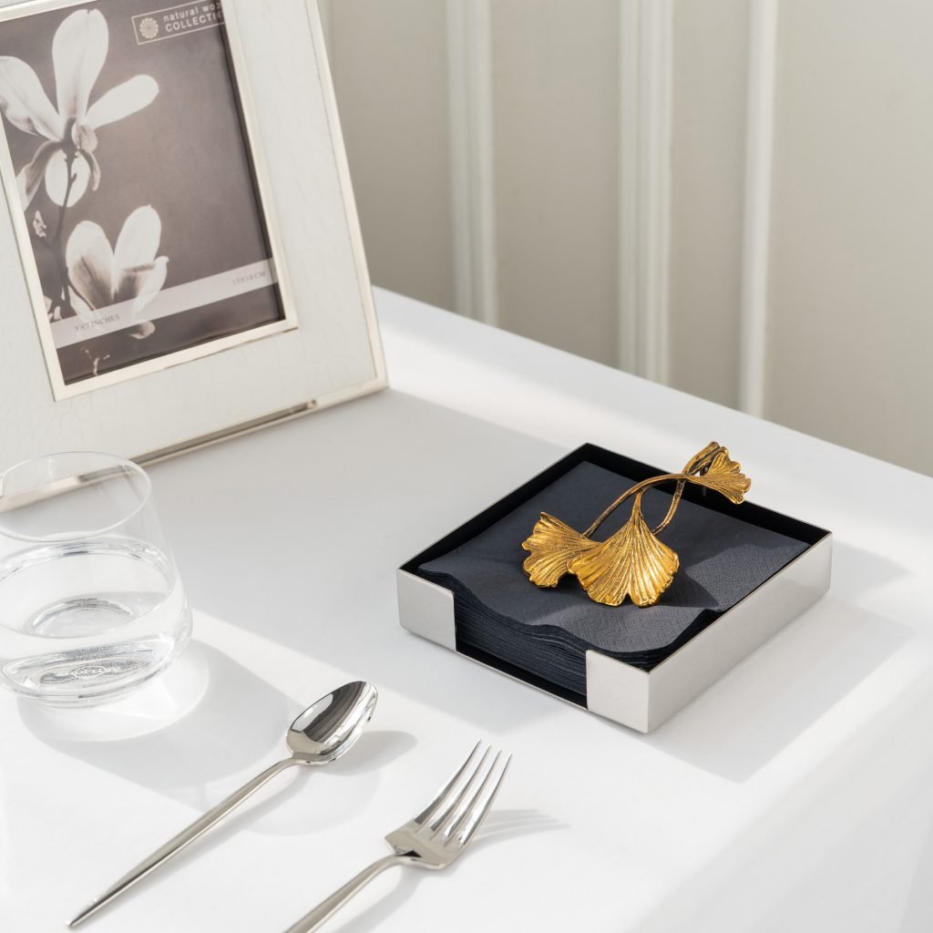 Steel Ginkgo Napkin holder (SS-97) featuring a mirror-polished ginkgo leaf sculptural design, showcased as a Luxury Mirror Polished Floral Holder.