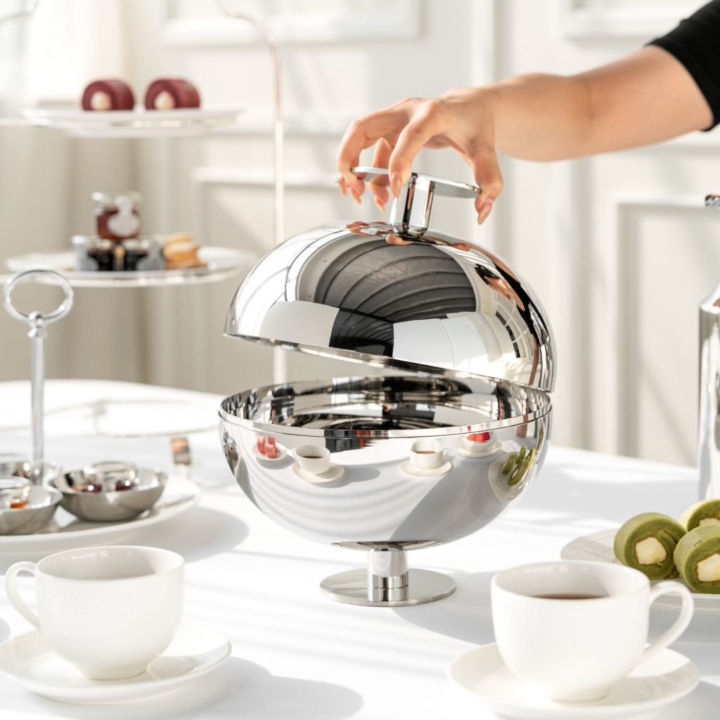 Steel Spherical Bowl (SS-64) featuring a deep, mirror-polished orb-like body with a sleek top opening for fruit, showcased as a Luxury Mirror Polished Orb Server.