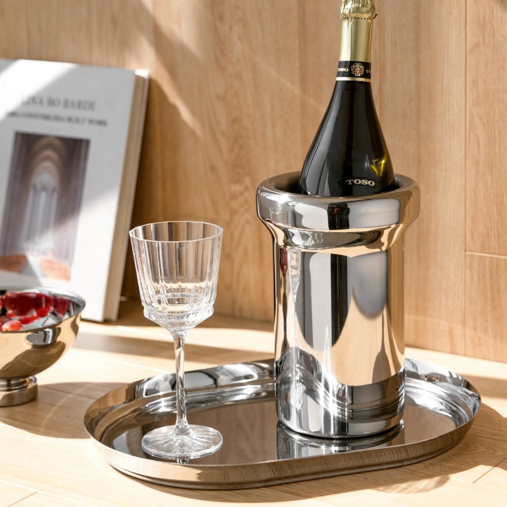 Steel Ice Bucket featuring a nearly invisible thin handle and matching tongs, showcased as a Luxury Mirror Polished Wine Chiller.