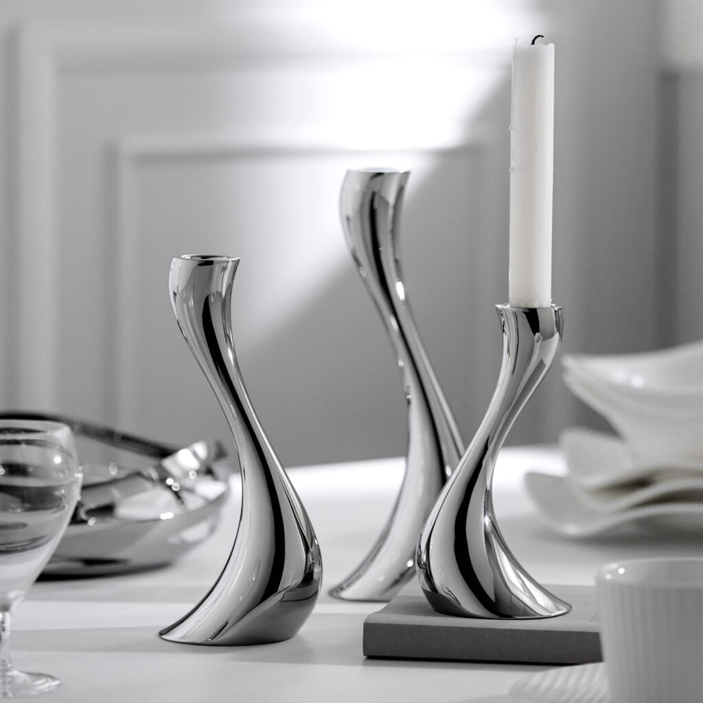 S-Curve Stainless Steel Candle Holder in silver and gold, showcasing a Luxury Mirror Polished Candelabra set on a dining table.