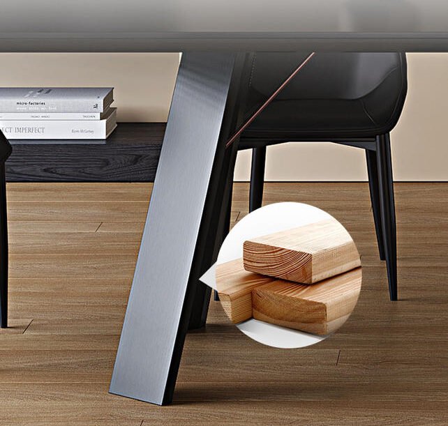 Close-up of the Apexerahomelife solid wood dining set JX-DTS-002 table leg showing the reinforced dark wood trestle structure and thin copper-colored metal support brace.