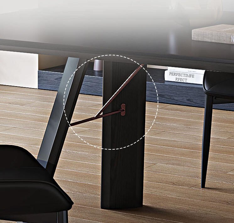 Close-up of the Apexerahomelife solid wood dining set JX-DTS-002 table leg showing the reinforced dark wood trestle structure and thin copper-colored metal support brace.