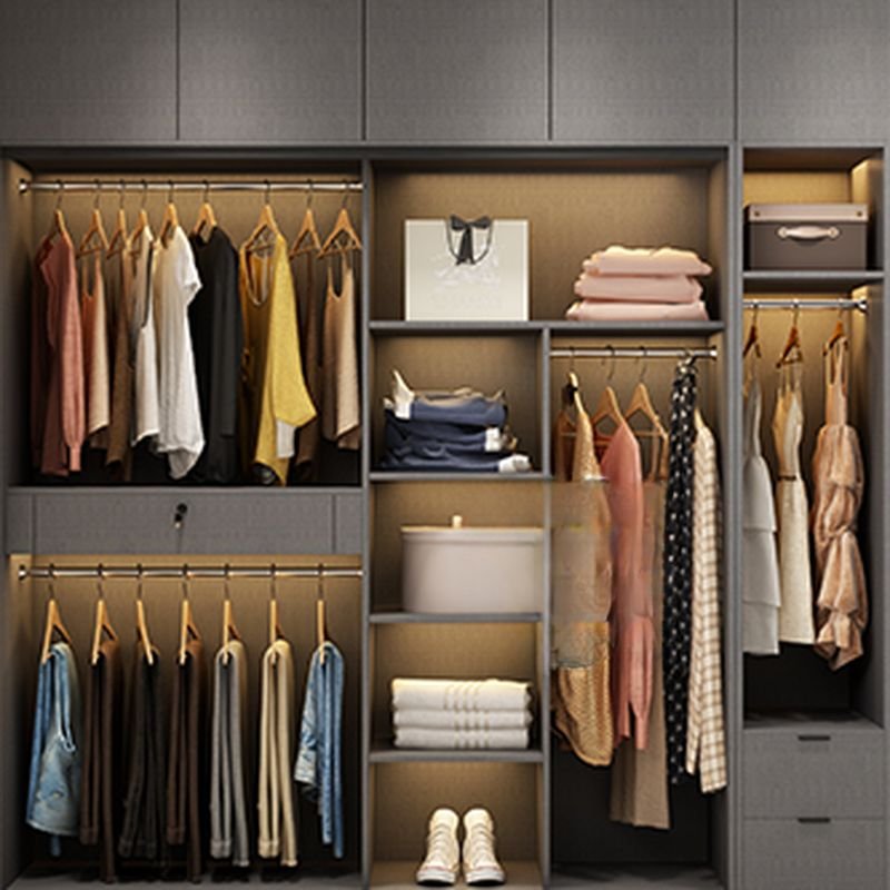 Internal view of a high-end modular closet system showing warm LED lighting, organized hanging rails, and adjustable shelves by Apexerahomelife.