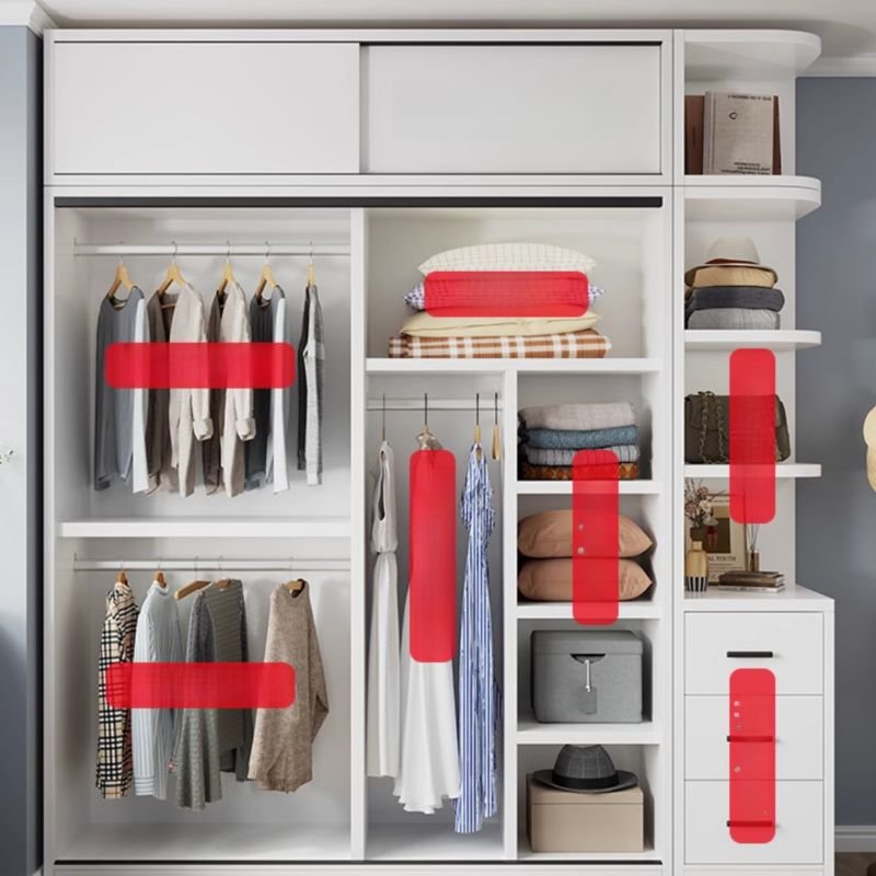 Interior view of a Space-Saving White Closet System with adjustable shelves and hanging rods for organized bedroom storage.