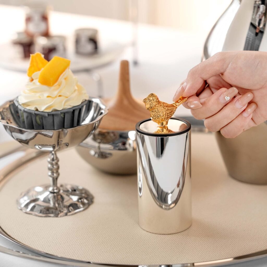 Steel Bird Toothpick holder (SS-107) featuring a mirror-polished base and a soaring bird finial, showcased as a Luxury Mirror Polished Bird Holder.