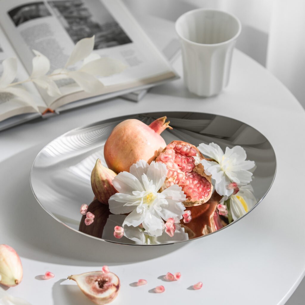 Steel Crinkled Bowl (SS-01) featuring a mirror-polished surface with dramatic organic folds and an irregular rim, showcased as a Luxury Mirror Polished Fruit Basin.