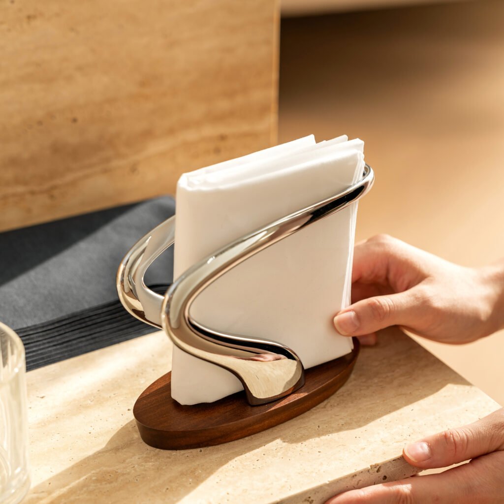 Steel Napkin Holder (SS-10) featuring a mirror-polished U-shaped vertical structure and a heavy-gauge base, showcased as a Luxury Mirror Polished Tableware Organizer.