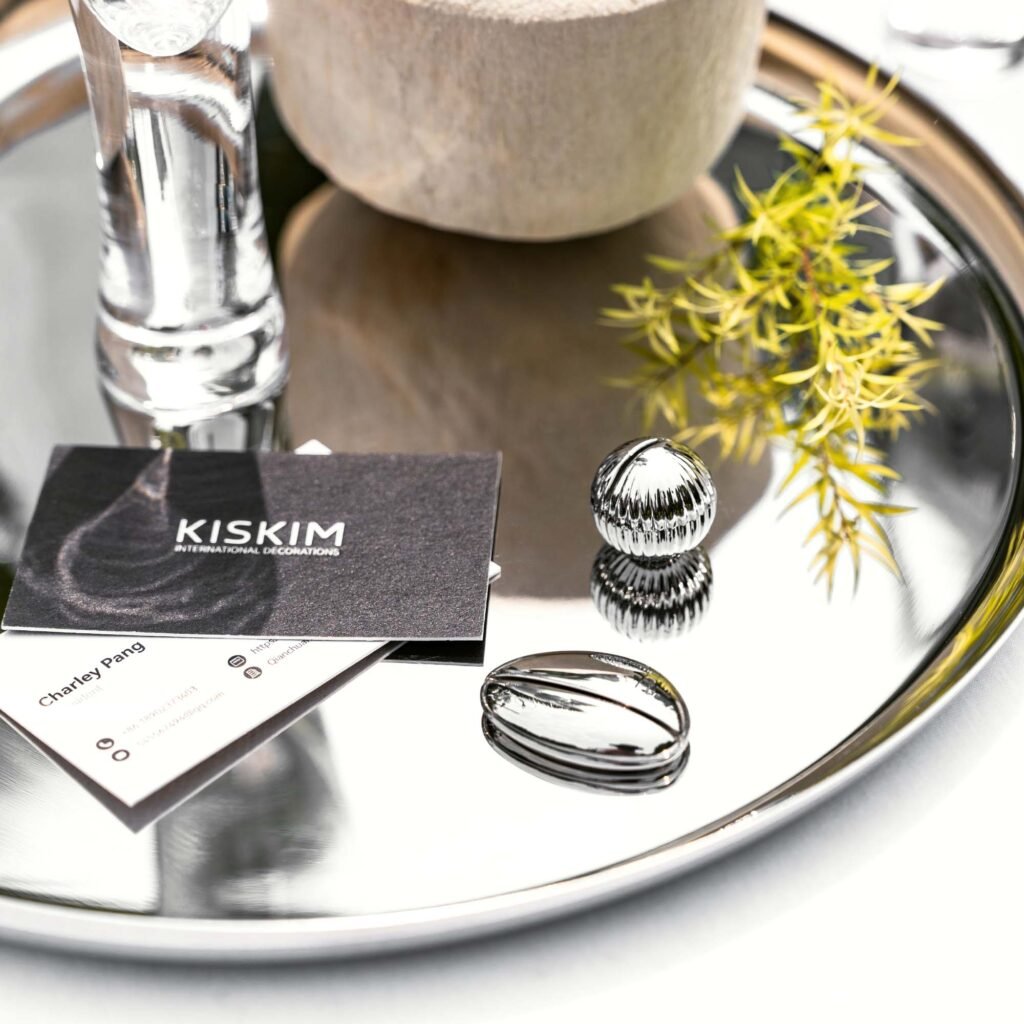 Steel Oval Card Holder (SS-104) featuring a solid mirror-polished oval base with a precision card slot, showcased as a Luxury Mirror Polished Card Stand.