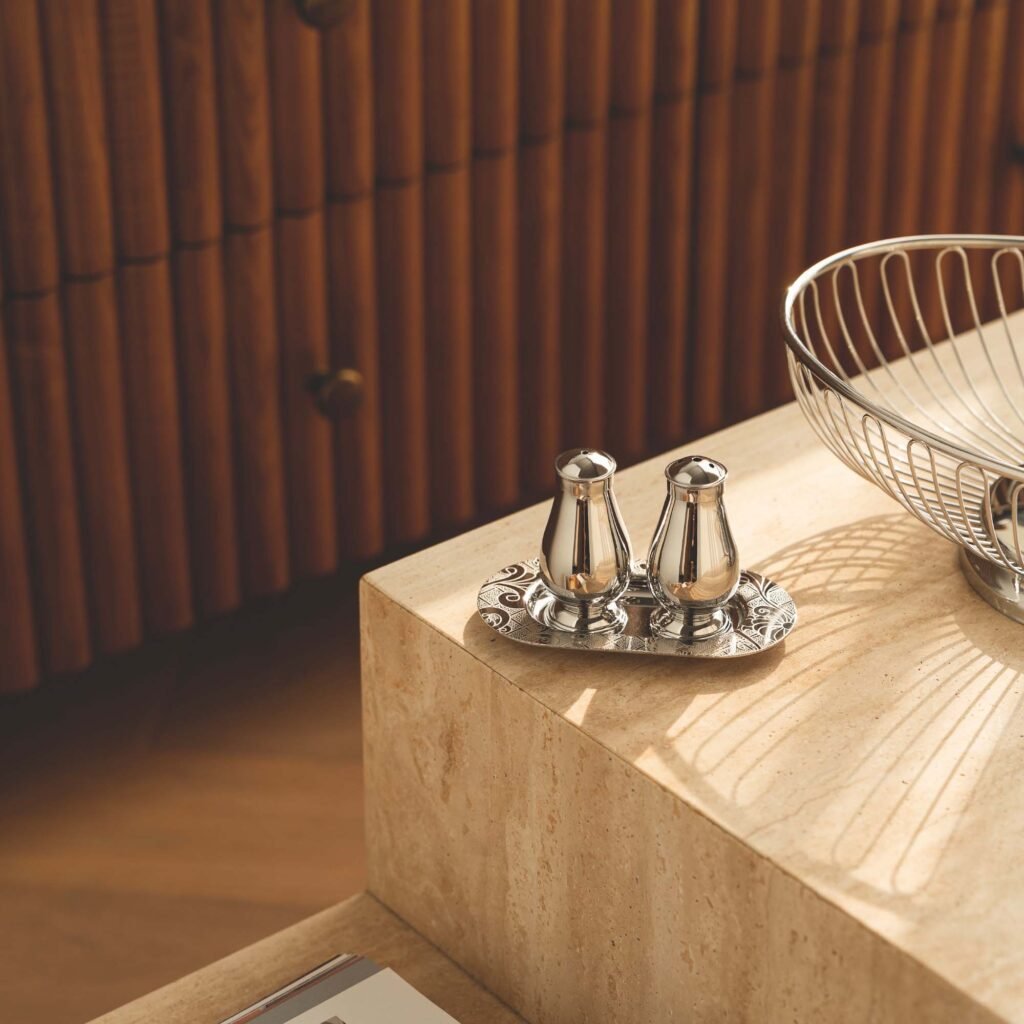 Steel Condiment Shaker featuring a mirror-polished cylindrical body and precision top holes, showcased as a Luxury Mirror Polished Spice Dispenser.