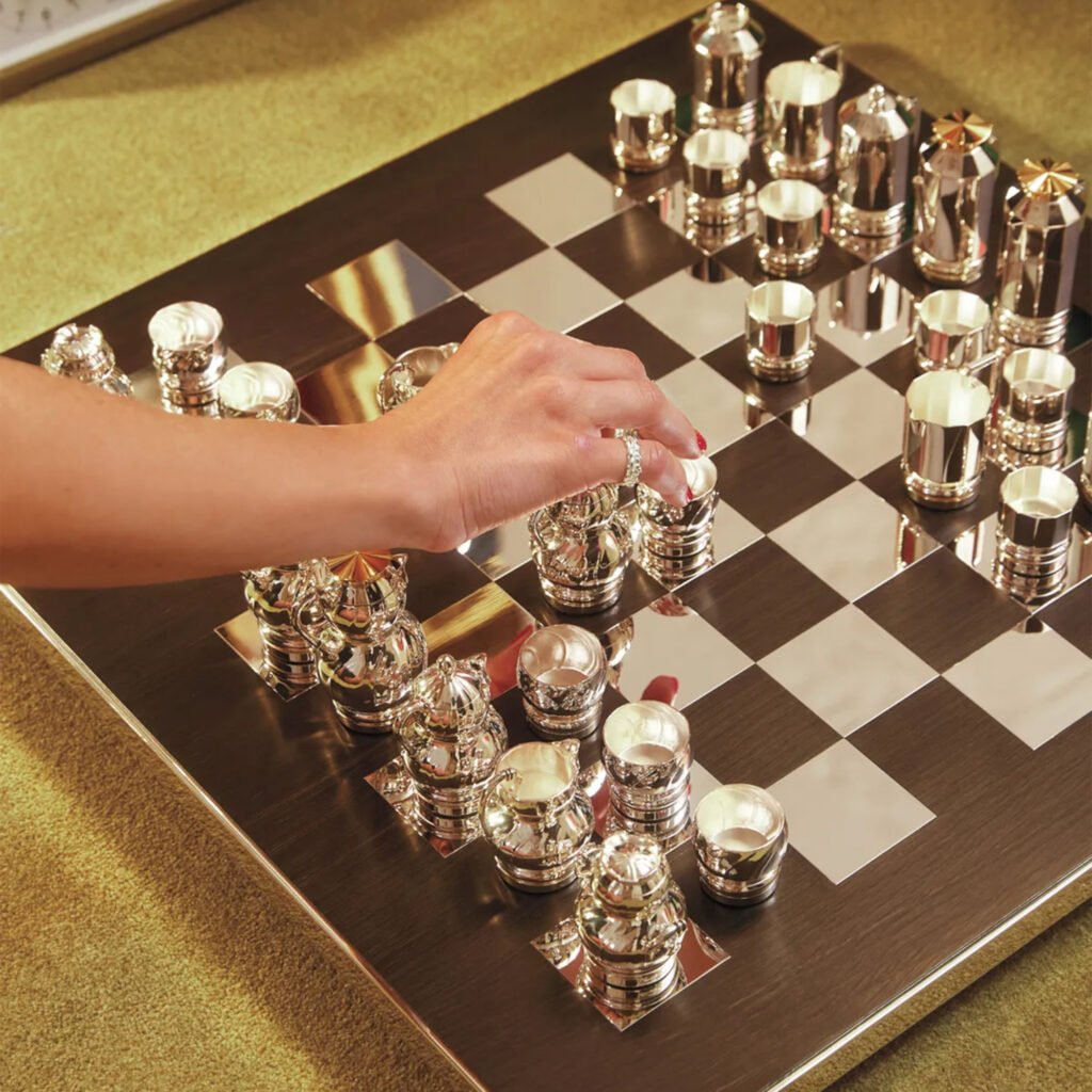 Steel Chess Set featuring all 32 stainless steel pieces arranged on a minimalist board, showcased as a Luxury Mirror Polished Xiangqi collection.
