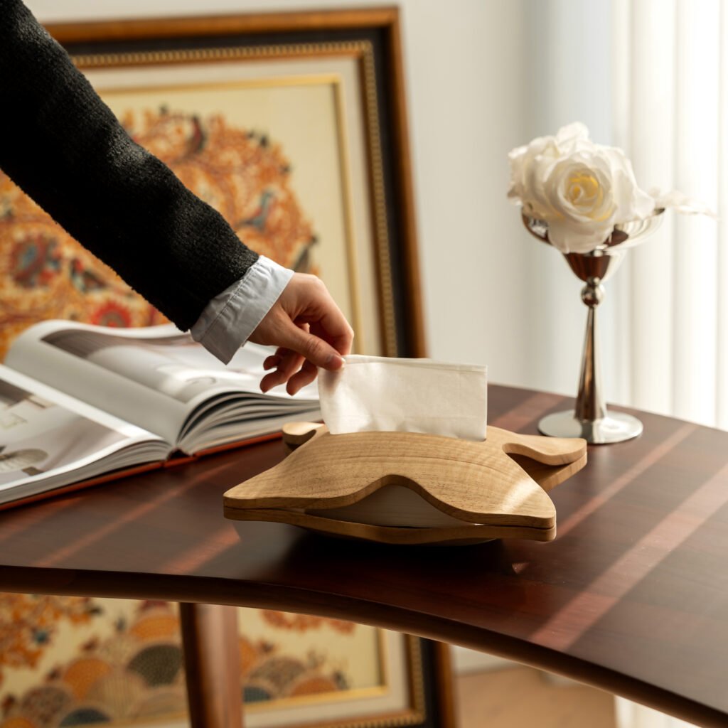 Close-up of the Modernist Butterfly Woodware, highlighting the seamless joinery and the elegant natural grain flowing across the sculptural wings.