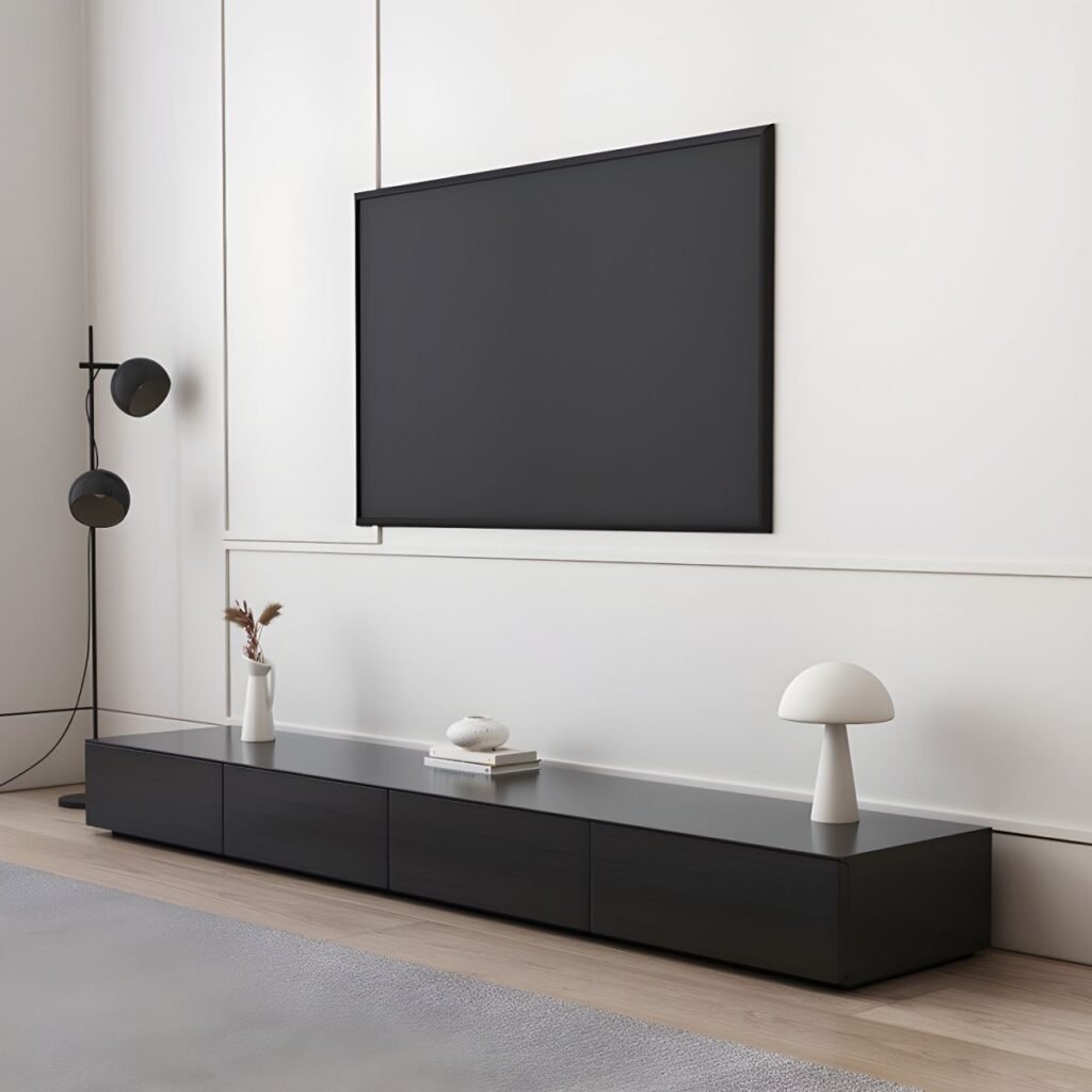 Side-angled view of the Bold 71 inch Entertainment Unit, showing the 180cm length and 40cm depth with a solid black finish.