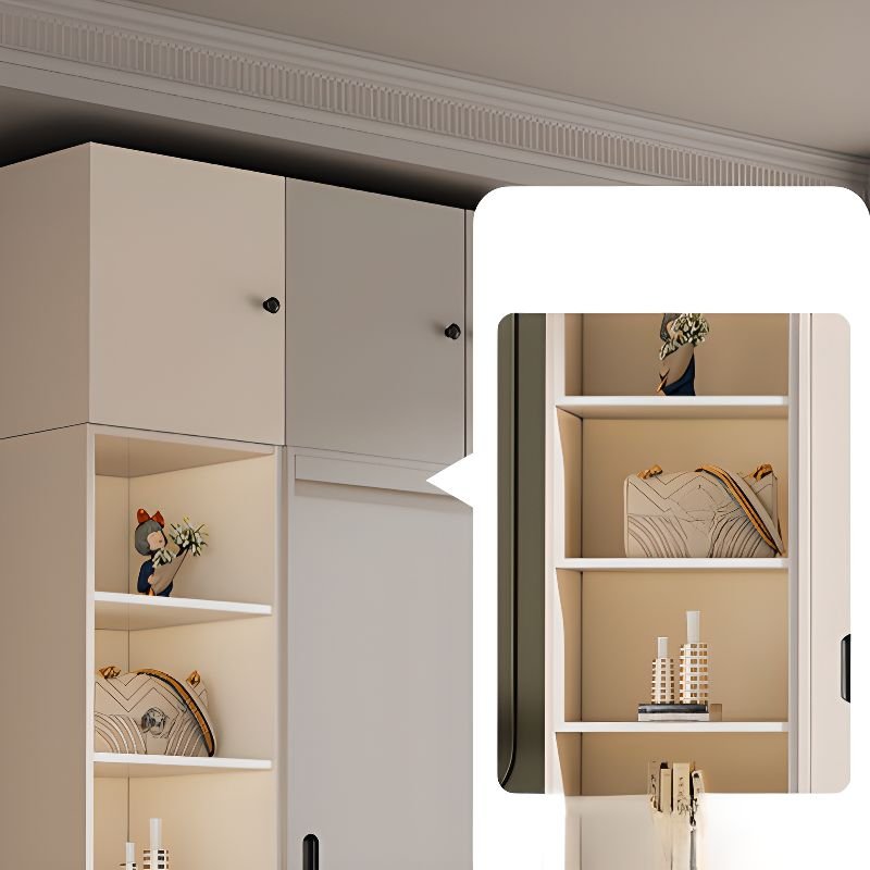 Interior organization of a Full-Height Modular Armoire showing adjustable shelves and reinforced hanging rails within a Sustainable E0 Engineered Wood Closet.