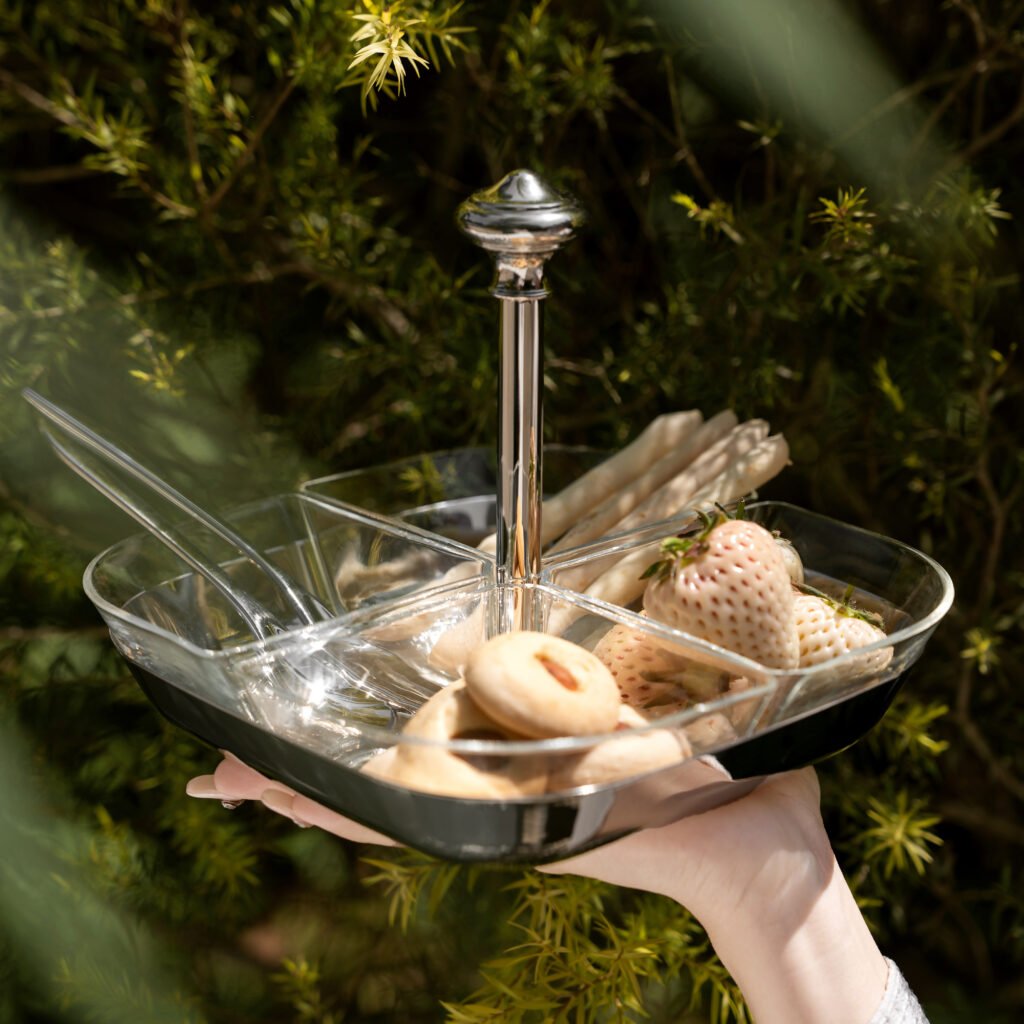 Glass Snack Server featuring four clear glass bowls arranged in a stainless steel frame with a loop handle, showcased as a Luxury 4-Compartment Appetizer Tray.