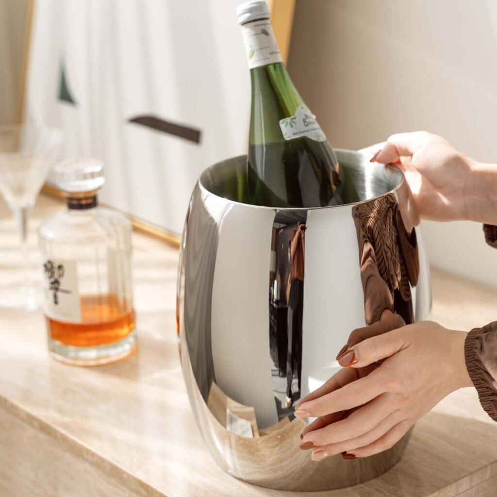 Steel Ice Bucket displayed in a minimalist luxury office setting, representing Reflective Modernist Tableware for high-end hospitality.