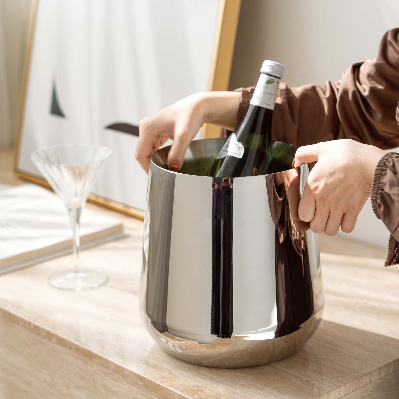 Steel Ice Bucket displayed in a modern luxury lounge, representing Reflective Modernist Tableware for high-end hospitality.