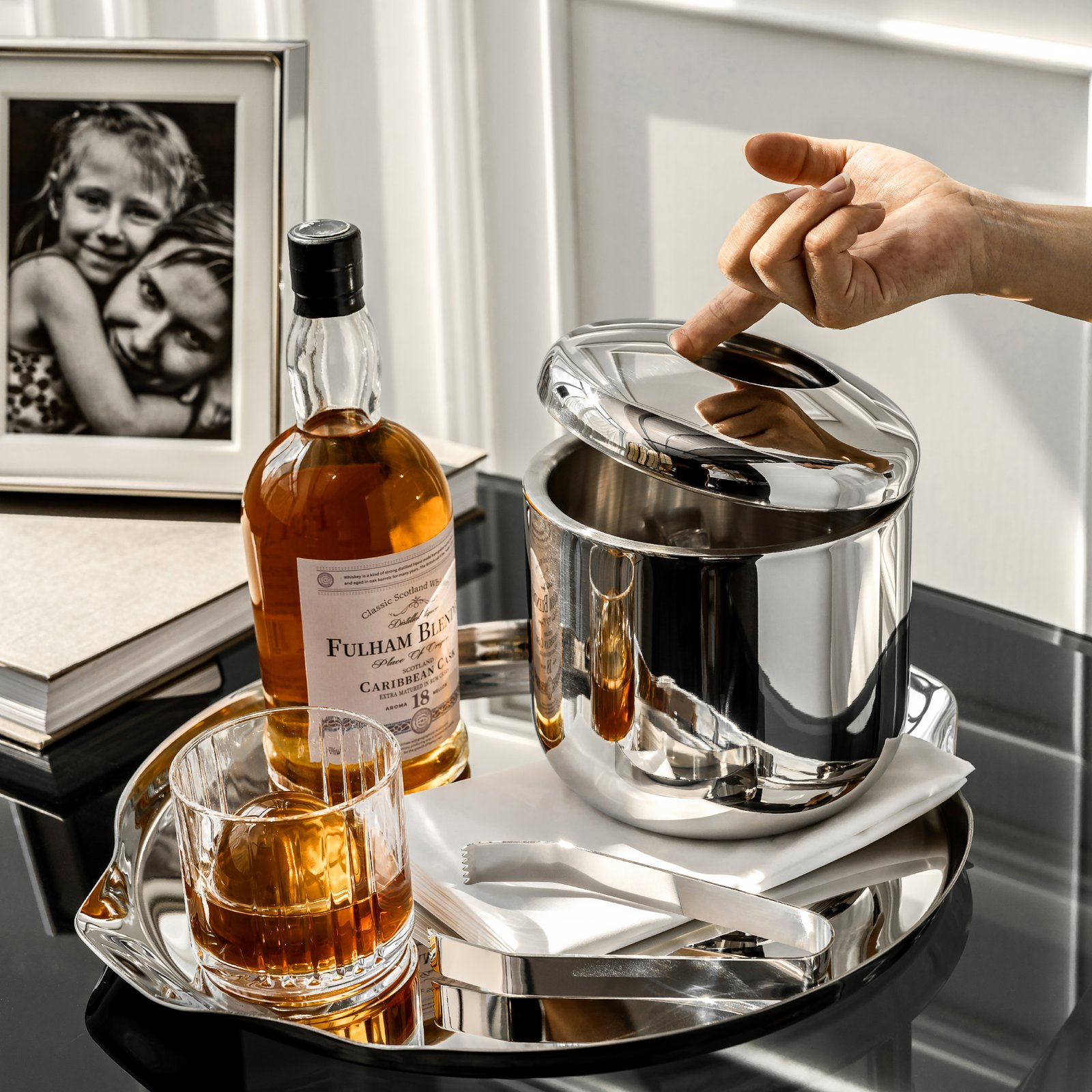 Close-up of the Symmetrical Loop Handle Barware, highlighting the precision-crafted rivets and the flawless chrome-like reflection.