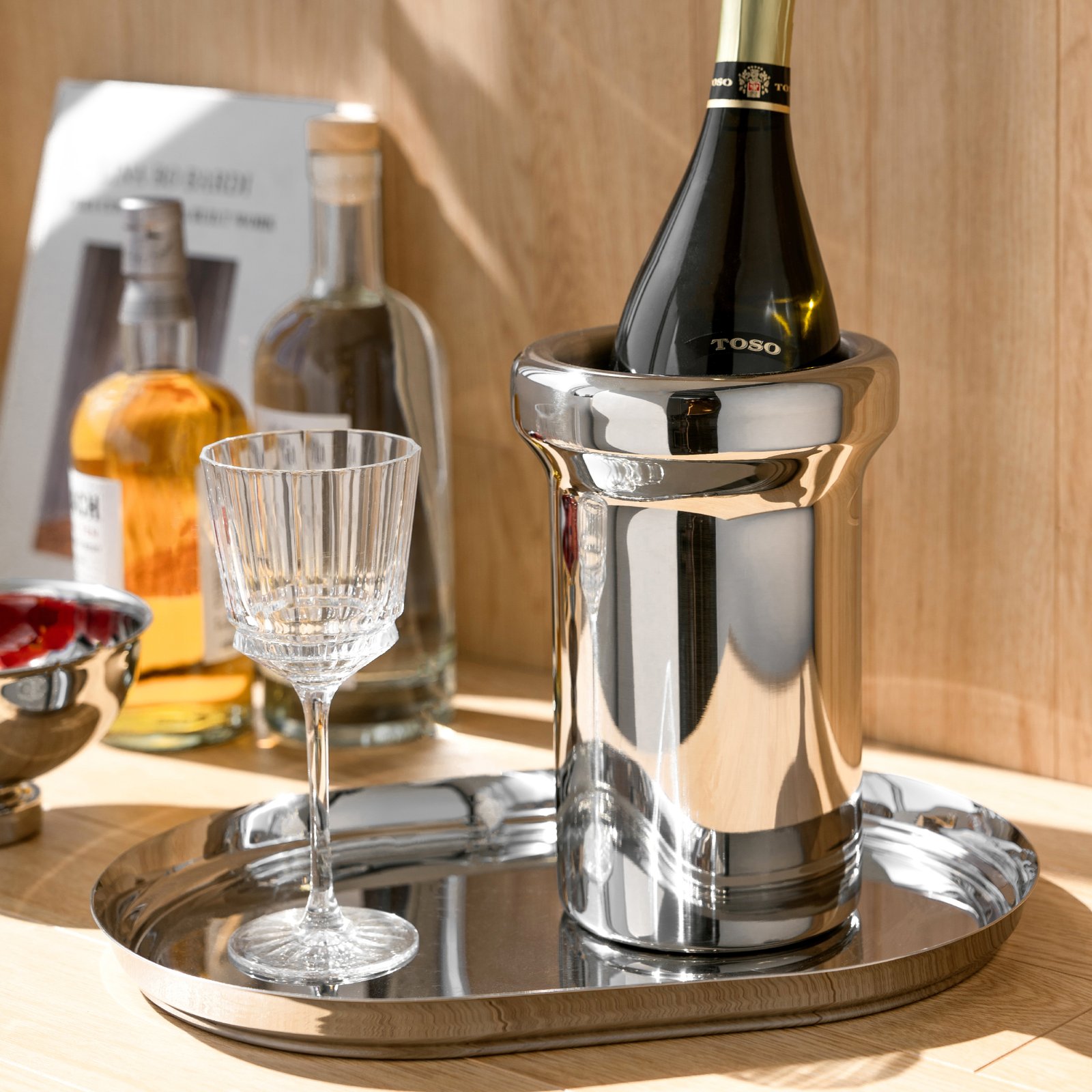 Steel Ice Bucket featuring a nearly invisible thin handle and matching tongs, showcased as a Luxury Mirror Polished Wine Chiller.