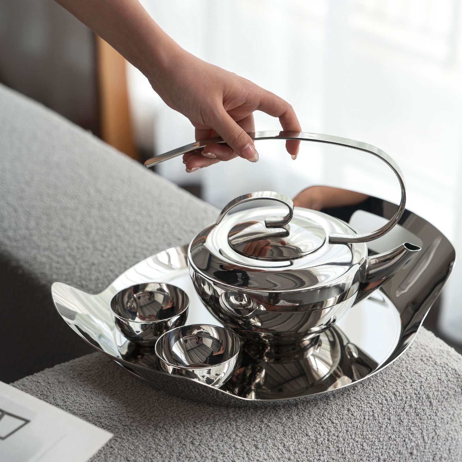 Steel Teapot Set in a modern executive setting, representing Reflective Executive Tea Ware for high-end professional environments.