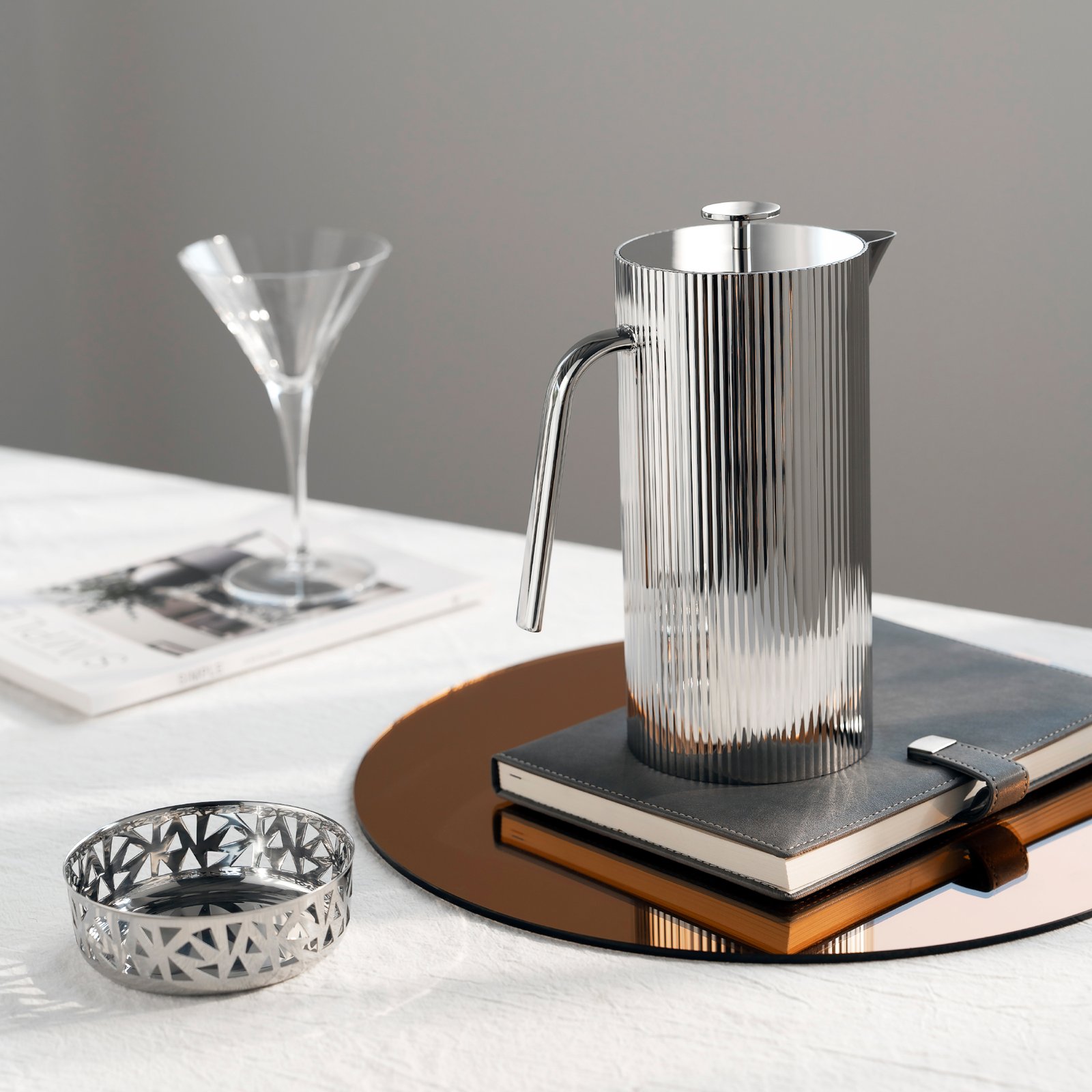 Steel Water Set in an executive office setting, representing Reflective Executive Tableware for high-end professional environments.