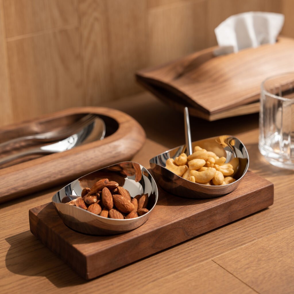 Steel Condiment Bowl placed on a slate serving board beside premium sea salt and herbs, representing Reflective High-End Culinary Art elegance.