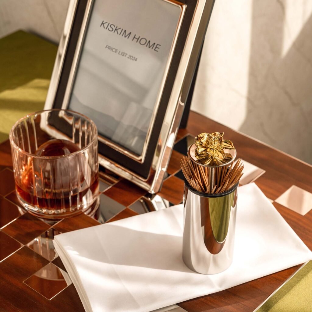 Steel Lotus Toothpick holder (SS-106) with a blooming lotus finial on a mirror-polished base, showcased as a Luxury Mirror Polished Floral Holder.