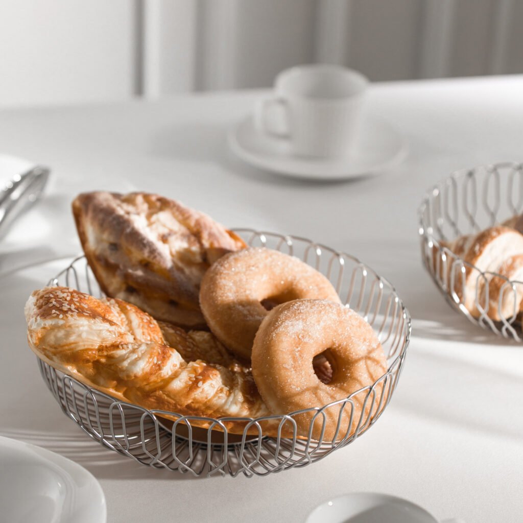 Steel Bread Basket (SS-02) featuring a mirror-polished shallow body with signature organic crinkle textures, showcased as a Luxury Mirror Polished Crinkled Server.