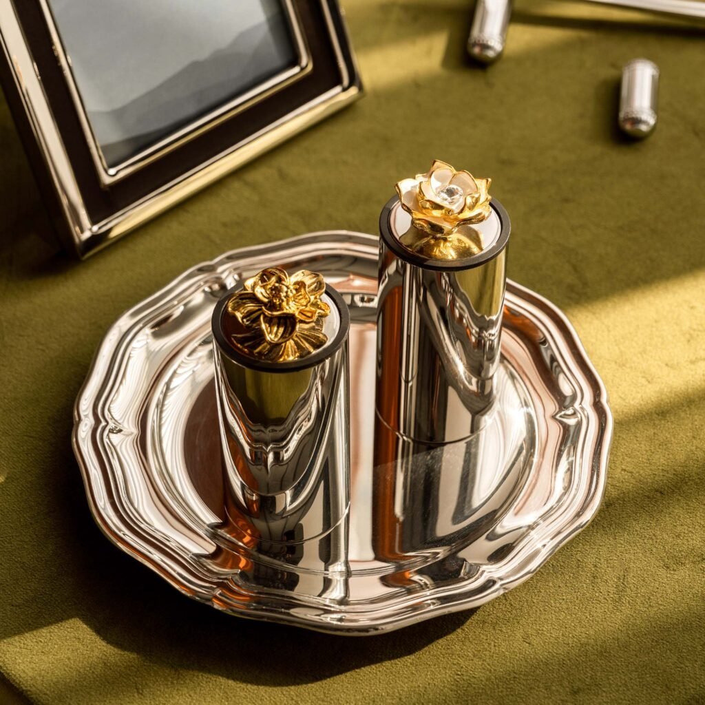 Close-up of the Modernist Romantic Tableware, highlighting the delicate petal layers and the deep-set reflective chrome finish.