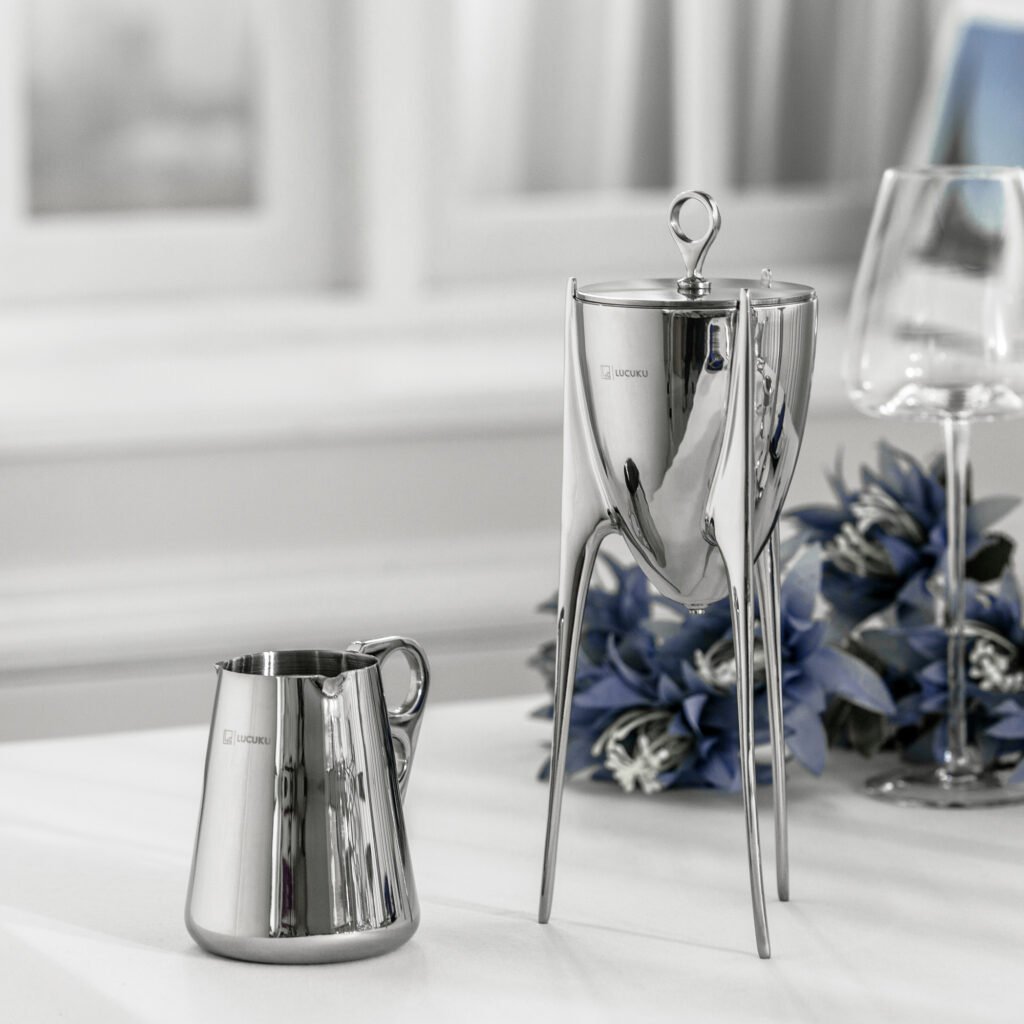 Steel Ding Pitcher placed on a dark rosewood boardroom table beside fine porcelain, representing Reflective High-End Oriental Art elegance.