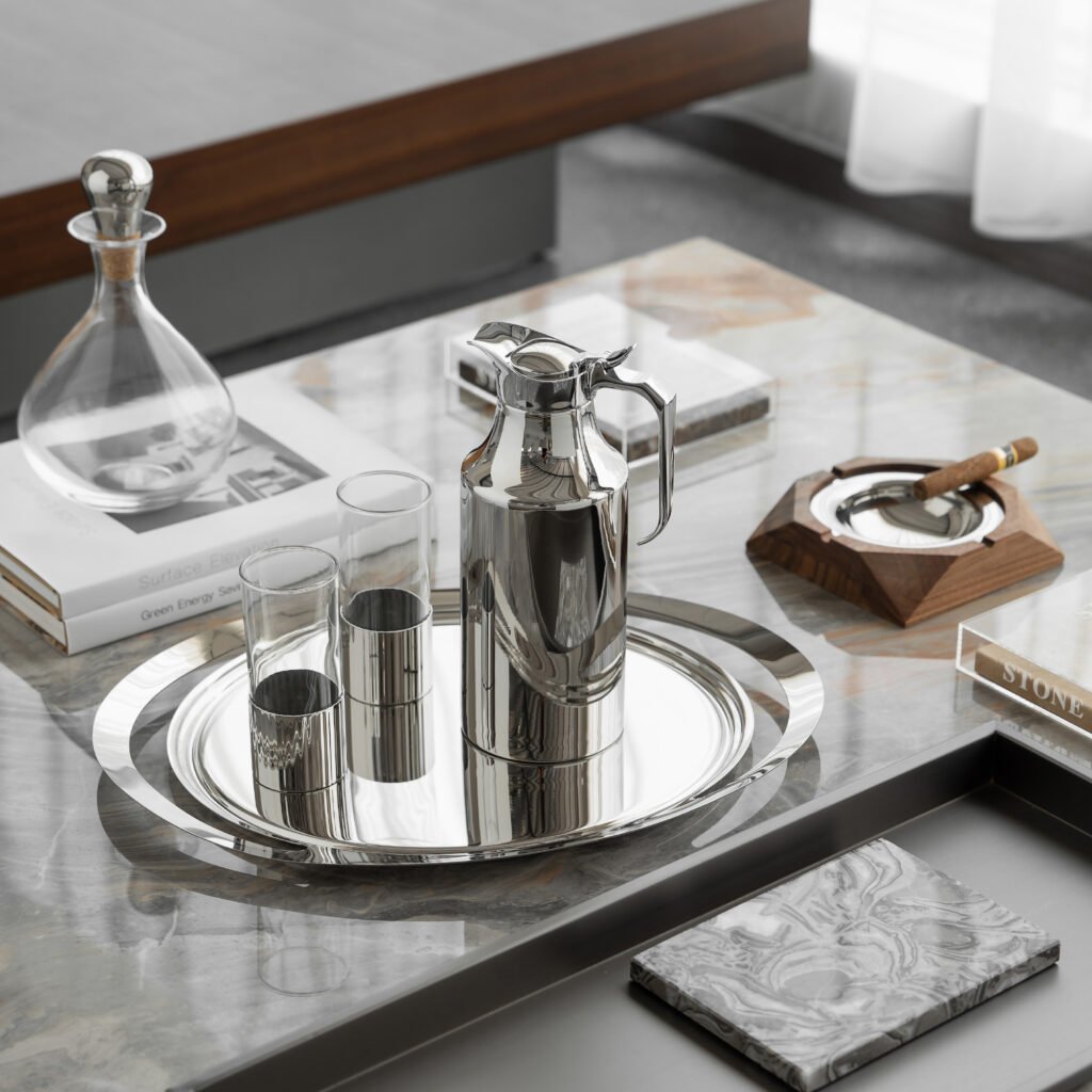 Steel Thermal Carafe placed on a polished marble conference table beside high-end stationery, representing Reflective High-End Functional Art elegance.