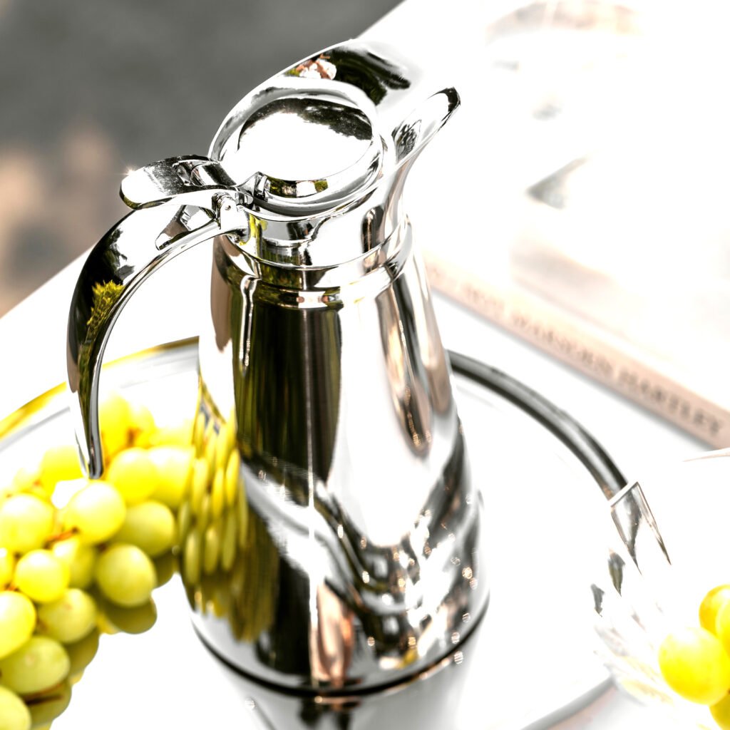 Steel Cylindrical Carafe (SS-25) featuring a mirror-polished vertical body and integrated geometric handle for professional beverage service, showcased as a Luxury Mirror Polished Vacuum Carafe.