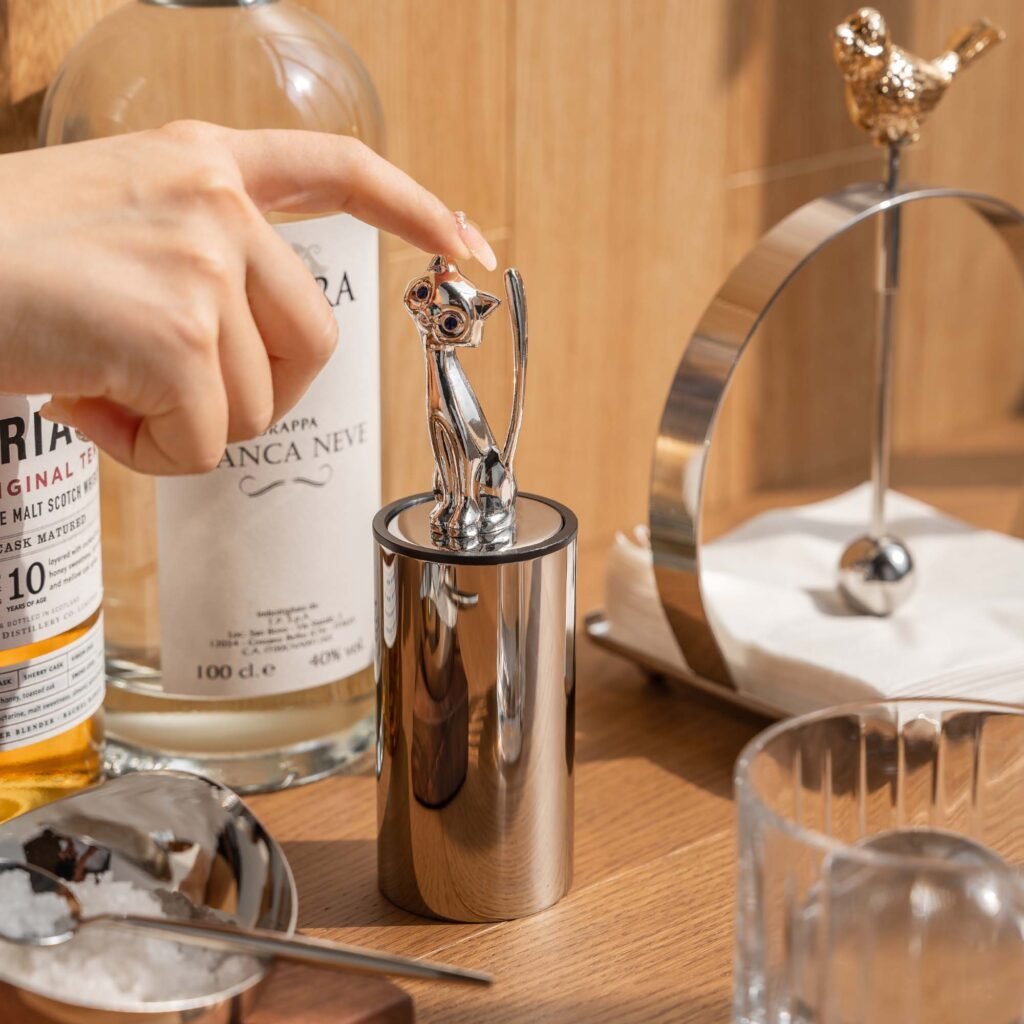 Close-up of the Modernist Animalistic Tableware, highlighting the smooth ear contours and the deep-set reflective chrome finish.