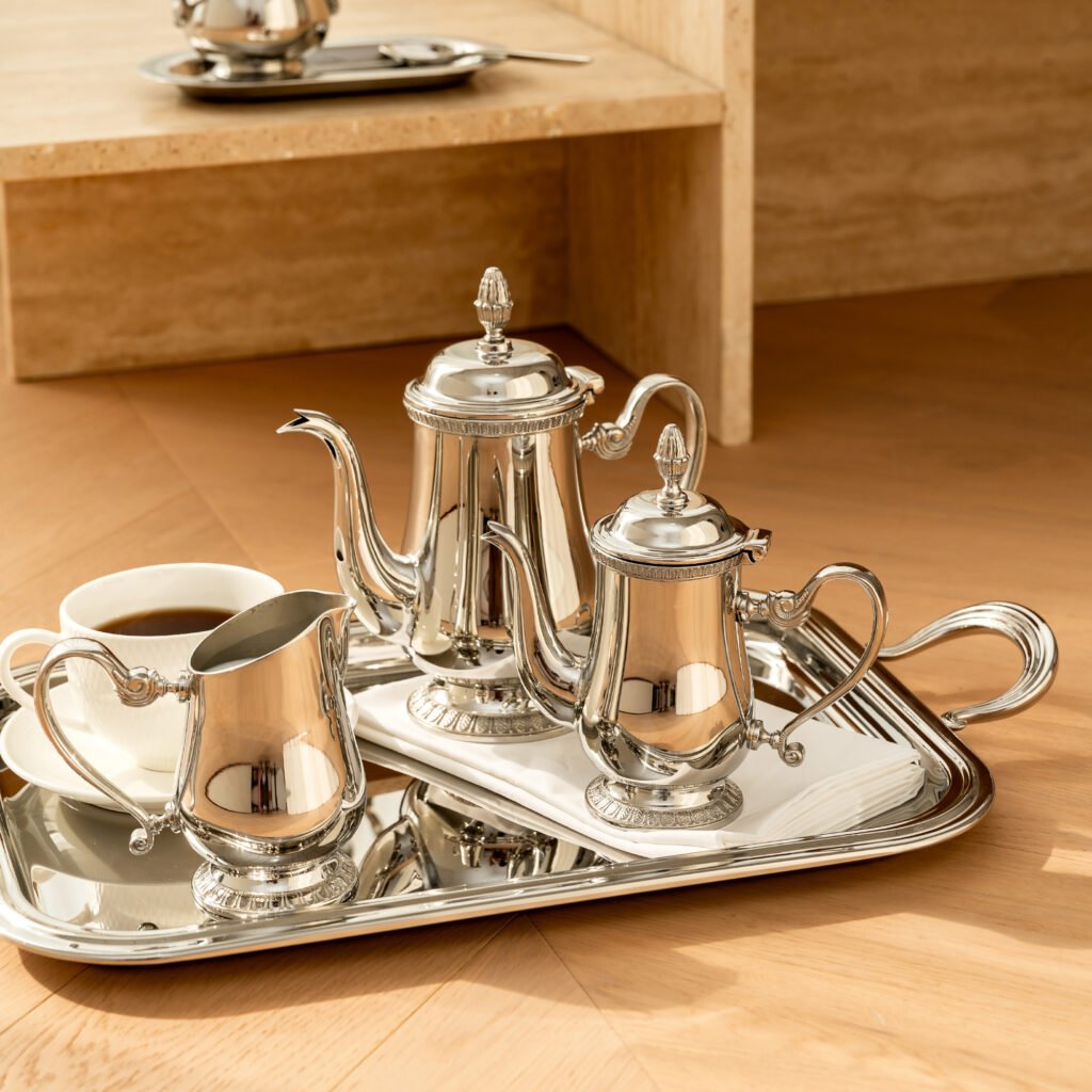 Close-up of the Modernist Minimalist Metalware, highlighting the precision-fitted plunger and the flawless, panoramic reflective exterior of the steel vessel.