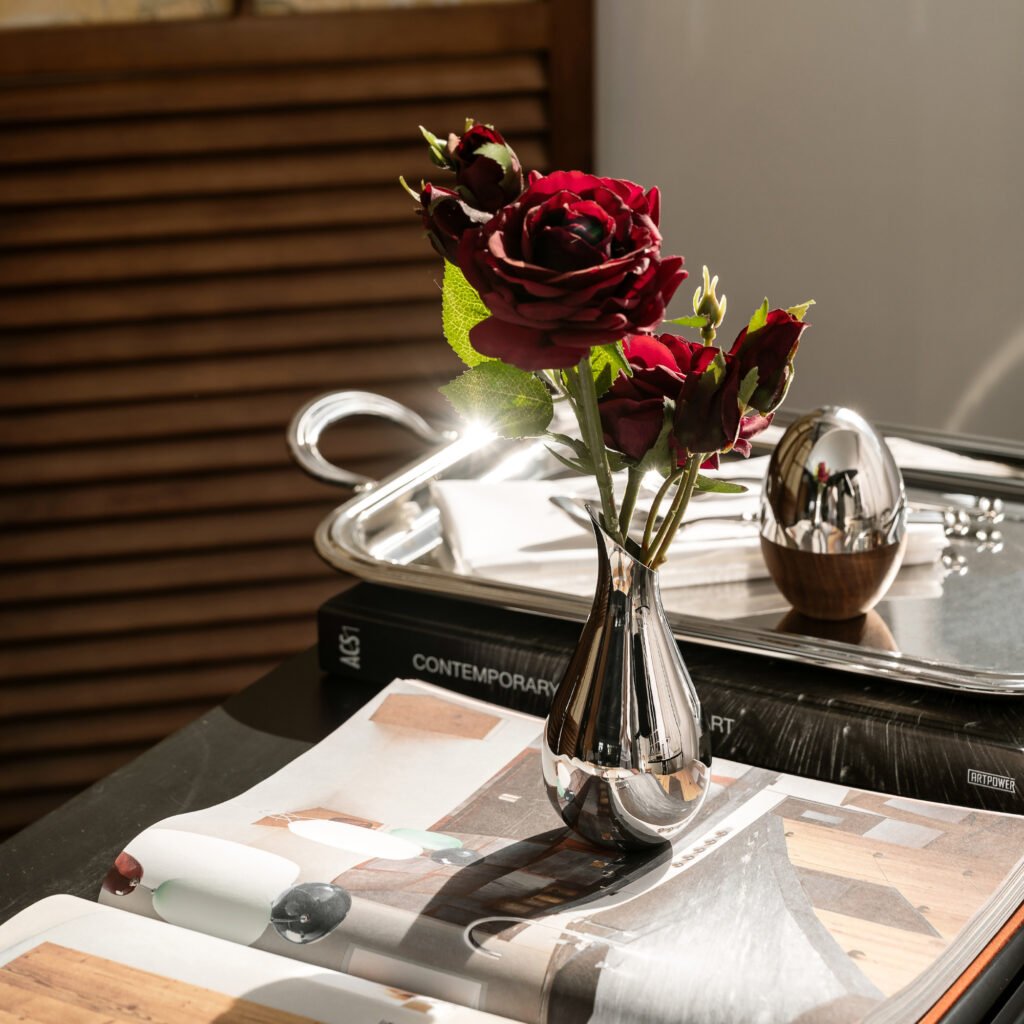Close-up of the Modernist Miniature Metalware, highlighting the seamless base welding and the flawless, high-clarity reflective exterior of the petite steel vase.