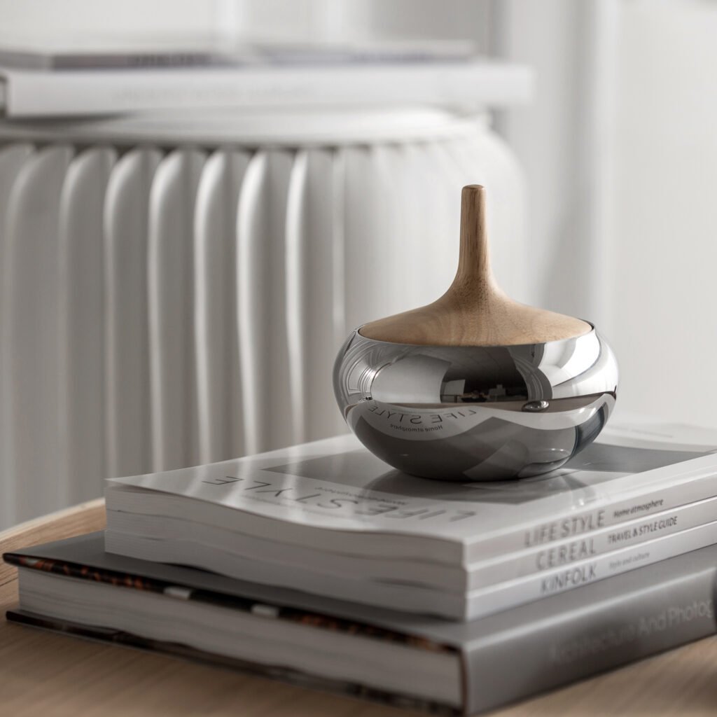 Steel Sculptural Vessel (SS-005 Droplet Jar) featuring a mirror-polished, seamless teardrop form with a precision lid, showcased as a Luxury Mirror Polished Artware.