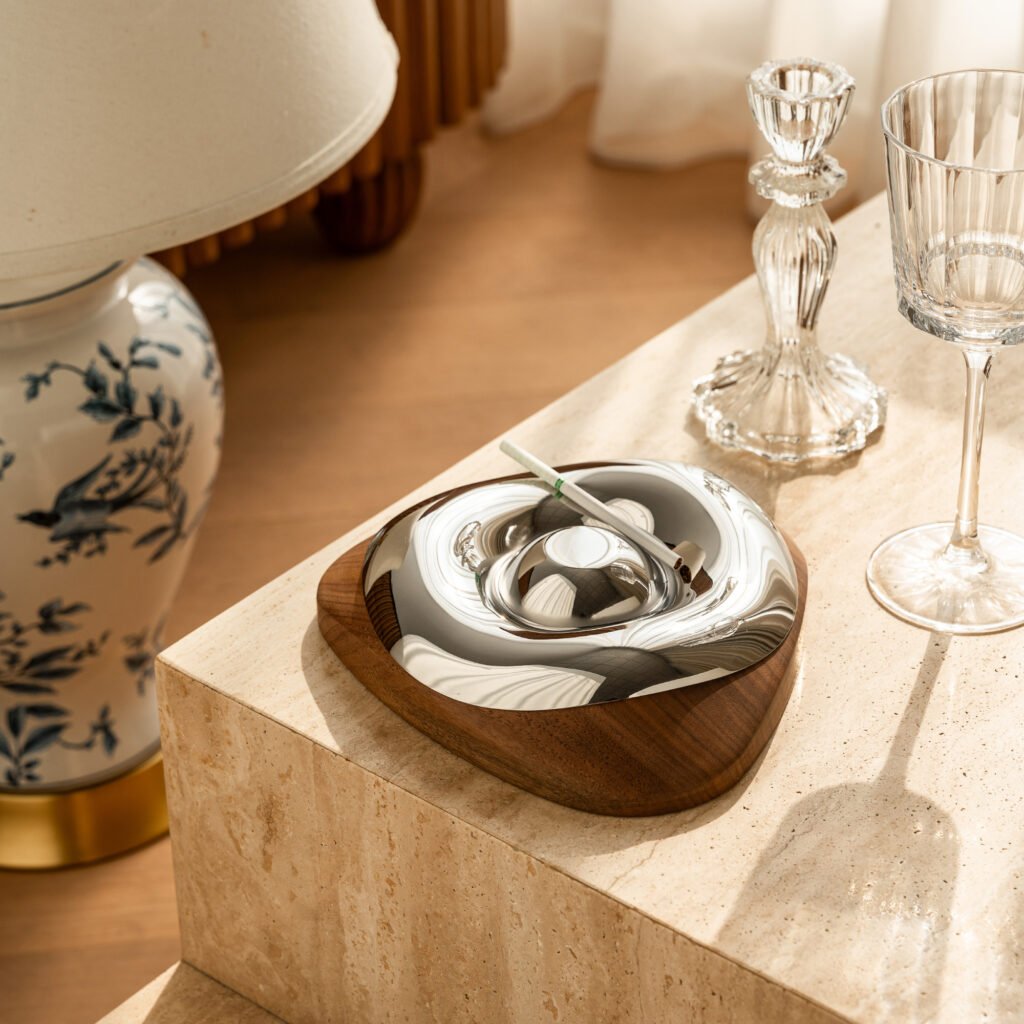 Close-up of the Modernist Bionic Metalware, highlighting the seamless joint between the egg-shaped bowl and the base, and the flawless panoramic reflection.