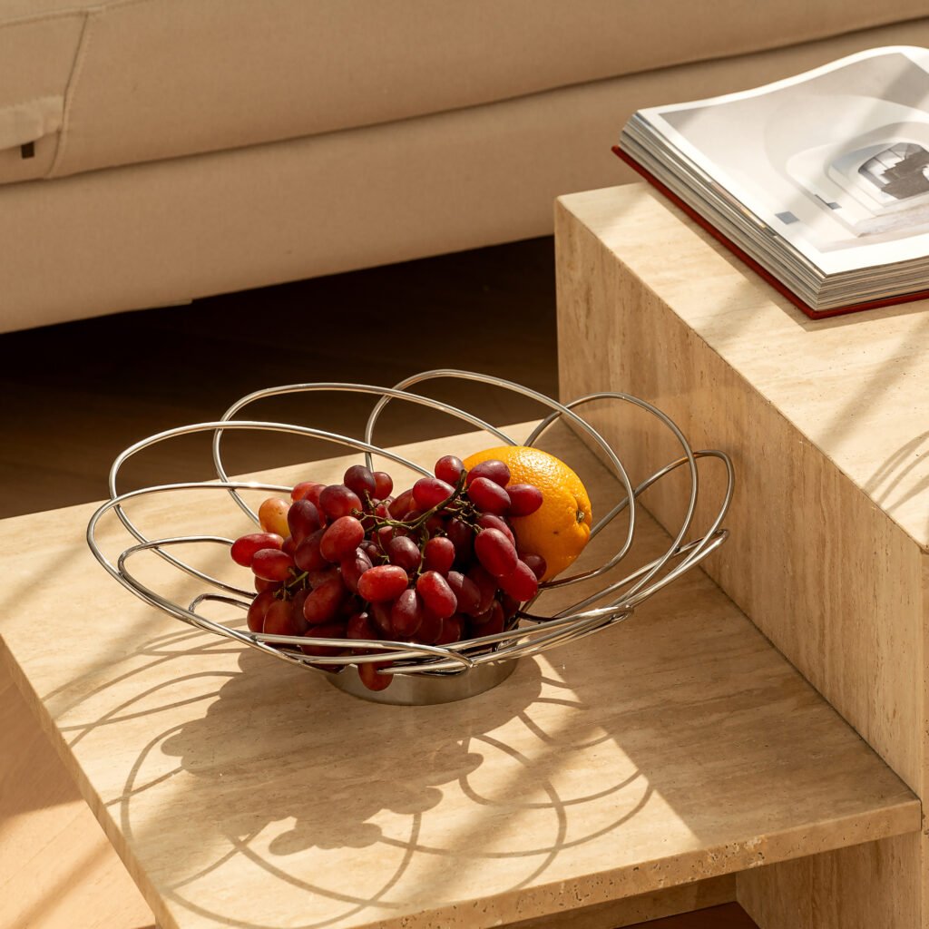 Close-up of the Modernist Bionic Metalware, highlighting the precision-curved petal edges and the complex, shimmering light reflections within the "bud" structure.