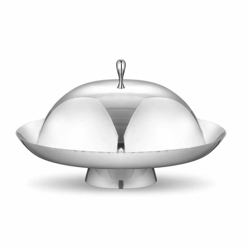 Steel Zeus Platter set in a luxury dining setting, capturing the distorted reflection of a candlelit room, representing Reflective High-End Table Art.