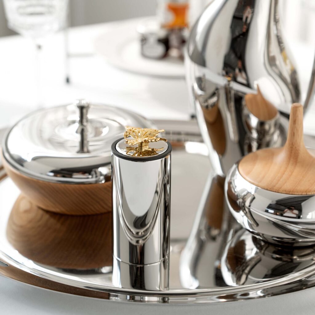 Steel Butterfly Toothpick holder (SS-106) featuring a mirror-polished base and an intricate butterfly finial, showcased as a Luxury Mirror Polished Butterfly Holder.