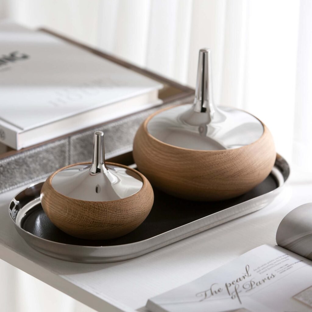 Steel Onion Jar (SS-07) featuring a mirror-polished spherical body with a signature pointed lid design, showcased as a Luxury Mirror Polished Storage Vessel.