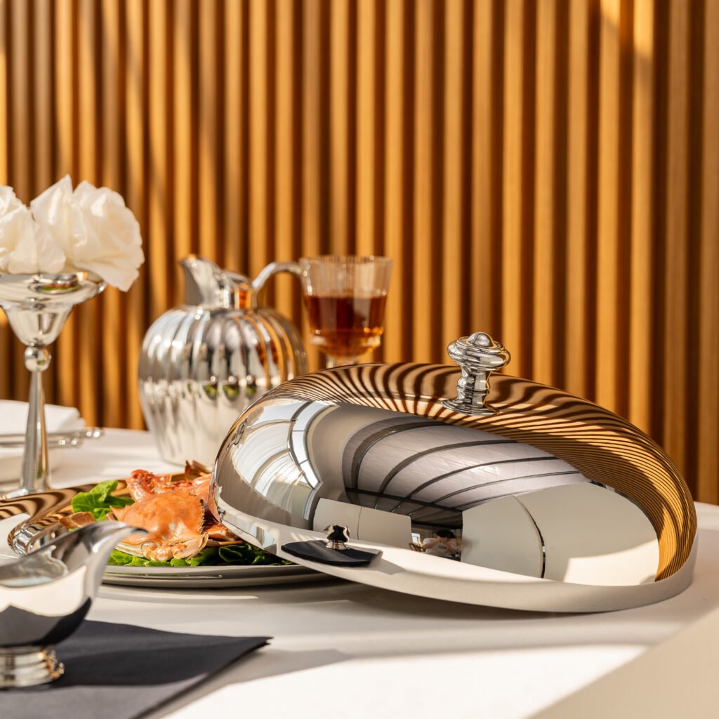 Steel Service Platter being used to serve premium appetizers in a high-end lounge setting, representing Reflective High-End Hospitality Art.