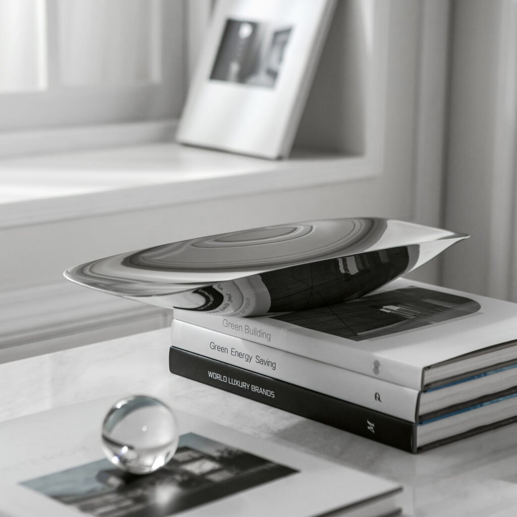 Close-up of the Modernist Asymmetrical Tableware, highlighting the thick-gauge steel edge and the high-clarity reflective interior of the angled basin.