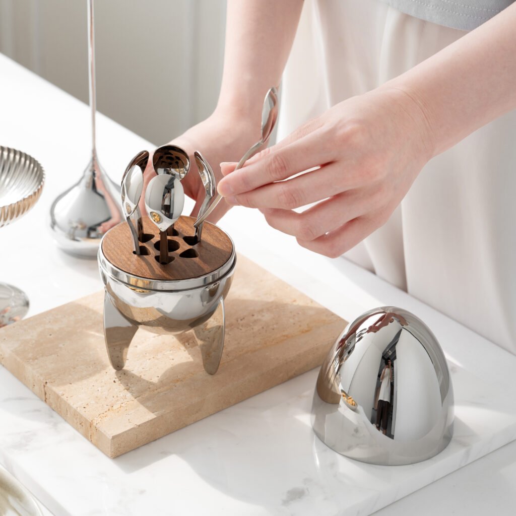Steel Rocket Tableware (SS-82) featuring a mirror-polished rocket-shaped stand holding an egg-shaped vessel, showcased as a Luxury Mirror Polished Egg Server.