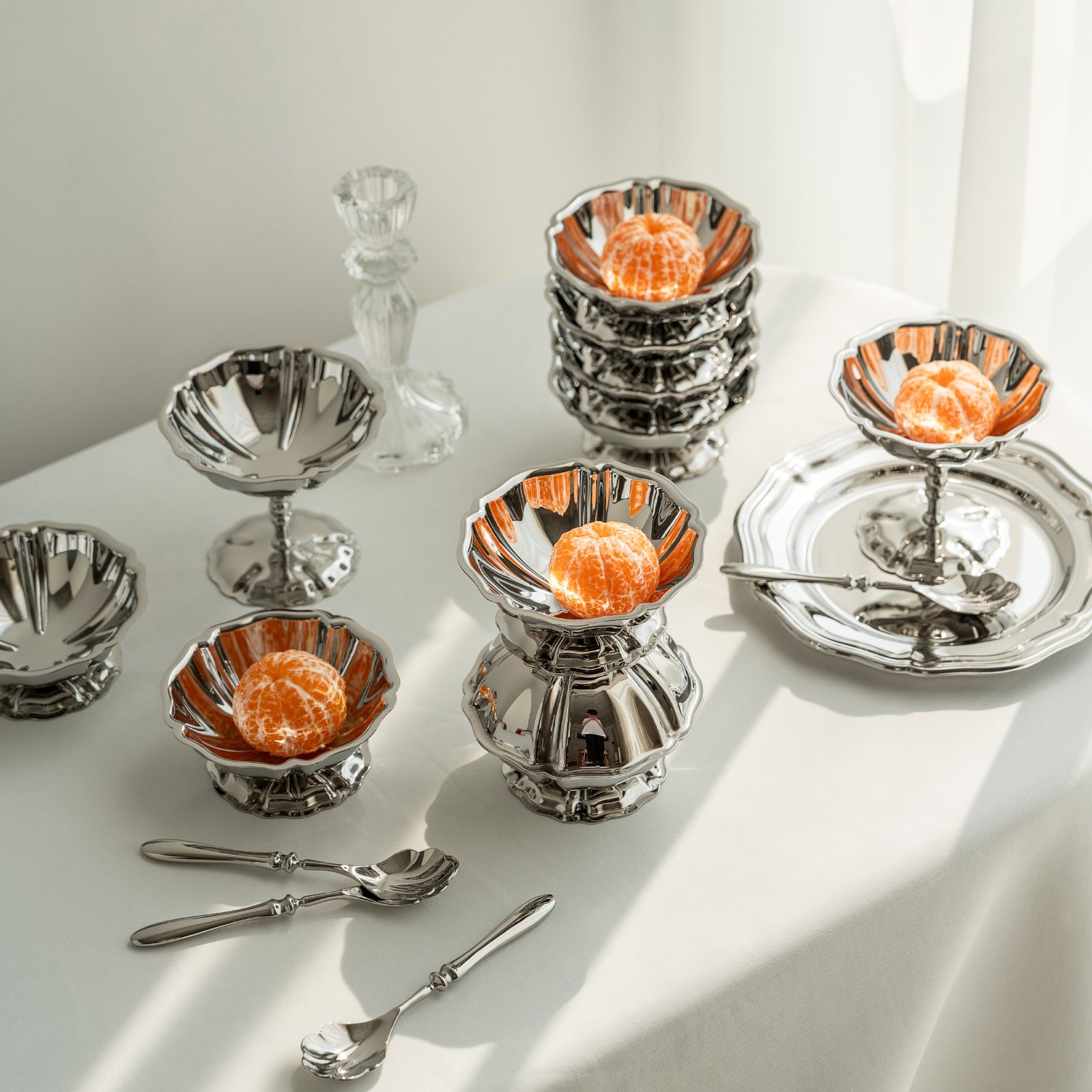 Close-up of the Modernist Low-Profile Tableware, highlighting the thick-gauge steel edge and the flawless, panoramic reflective surface.